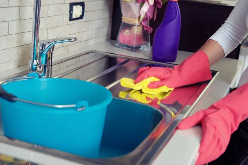 Local oven cleaner working in a modern SE1 apartment kitchen