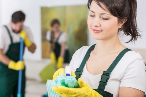 Professional cleaner tidying a kitchen in SE1